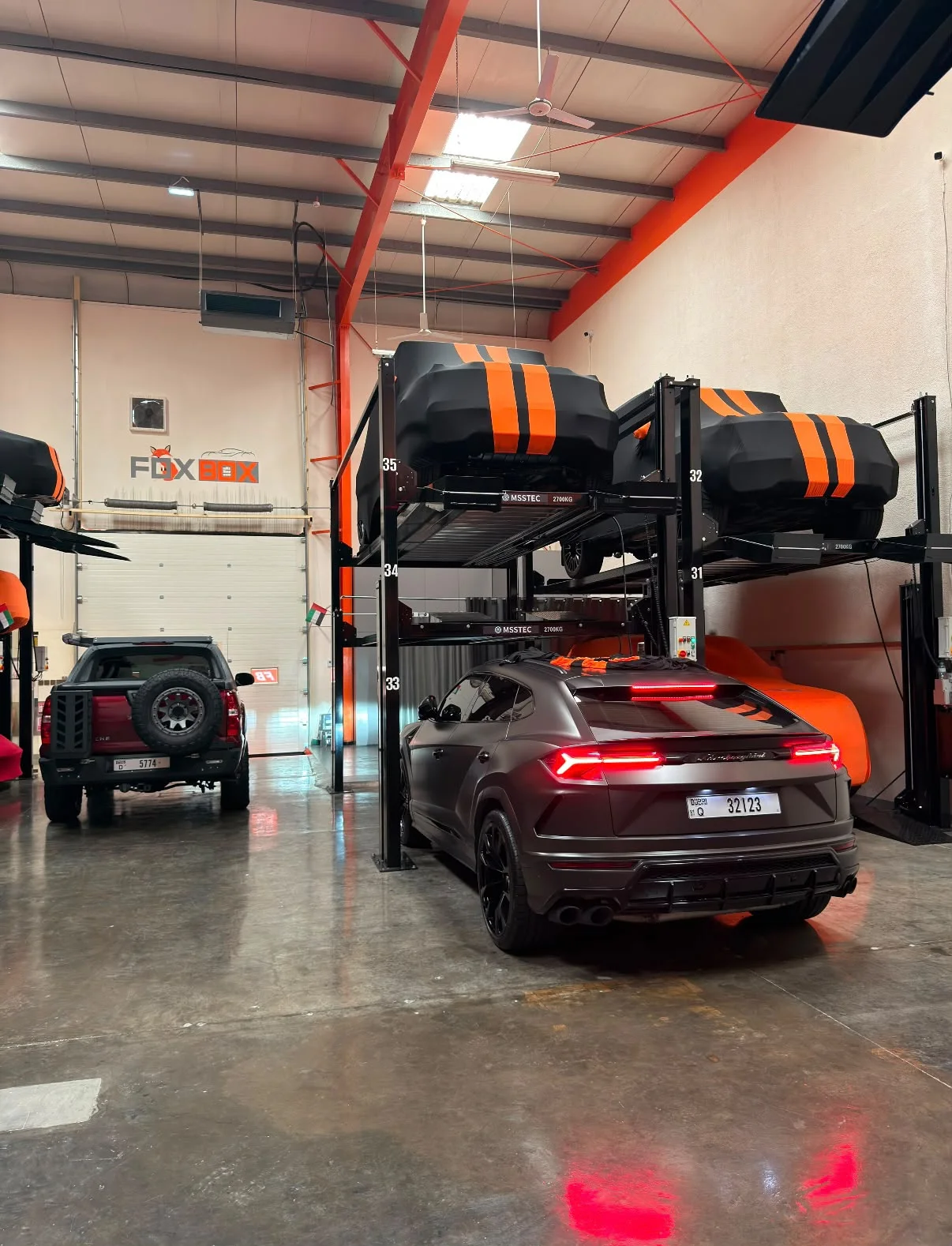 Lamborghini Urus and a row of car lifts